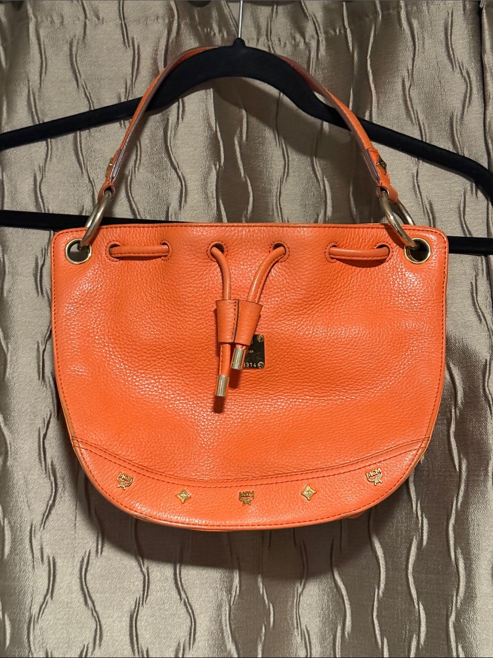 MCM Orange Pebbled Leather Drawstring Shoulder Bag
